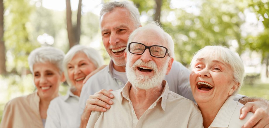 Cheerful old people standing on the street